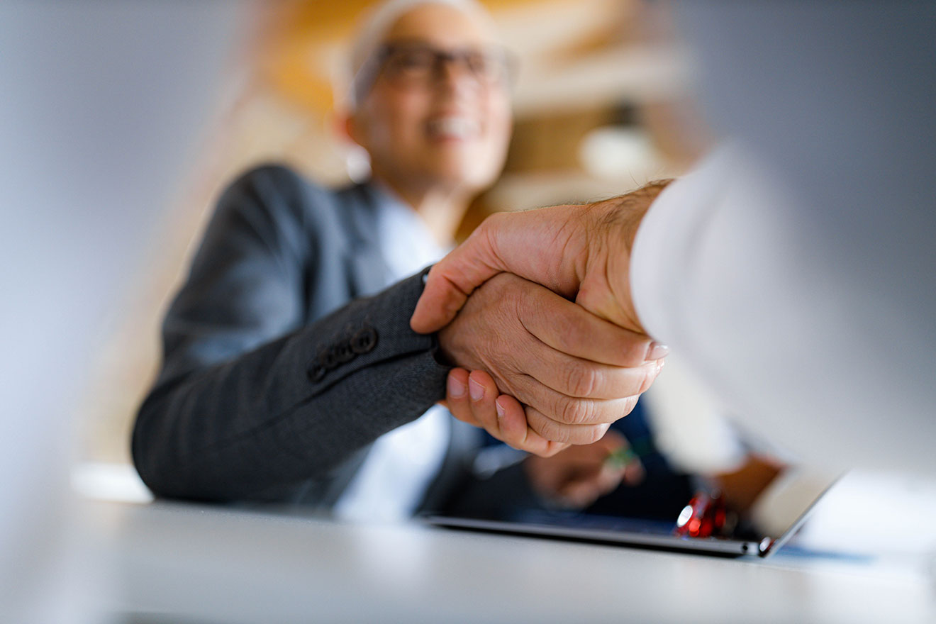 two men shaking hands