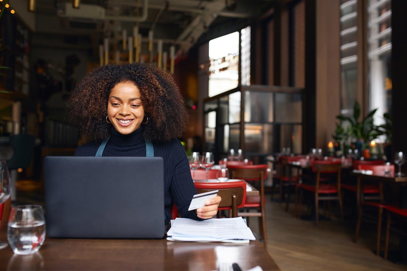 restaurant owner using the computer for business banking