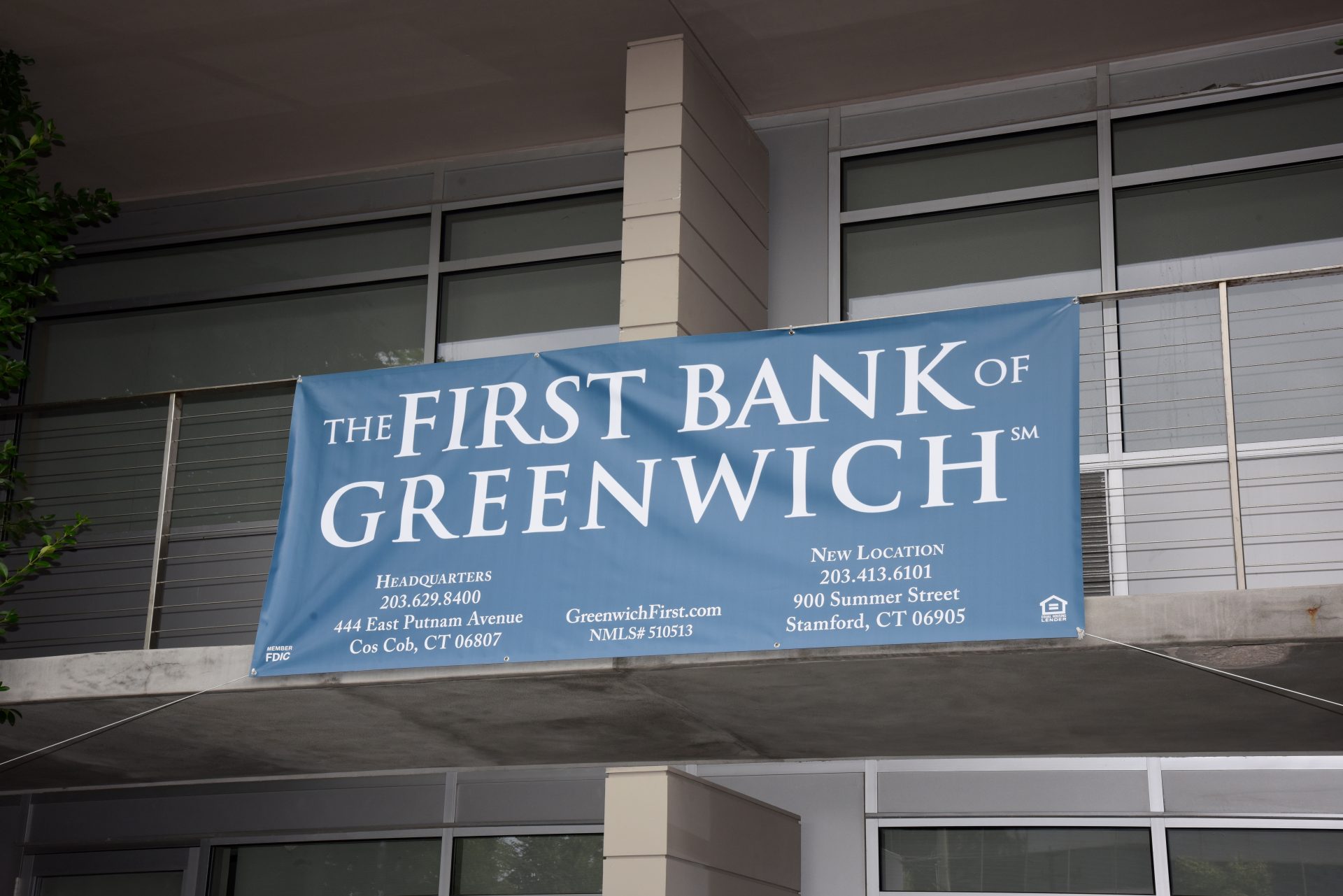 The First Bank of Greenwich hanging on outside balcony.
