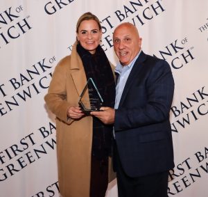 Laura McKittrick with Frank Gaudio and her Infi Award