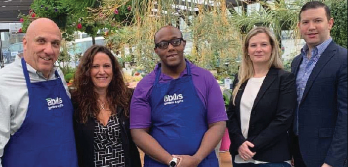 First Bank of Greenwich (FBOG) President and CEO Frank Gaudio; Abilis President and CEO Amy Montimurro; Abilis client Theo Brown; FBOG Vice President and Retail Banking Manager Emily Newcamp; and FBOG Chief Lending Officer Evan Corsello, at Abilis’ greenhouse. (Greenwich Sentinel photo)