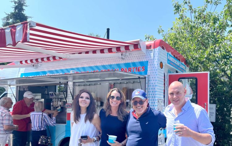 Friends enjoy the hot summer afternoon at the bank’s ice cream social at its Cos Cob office.