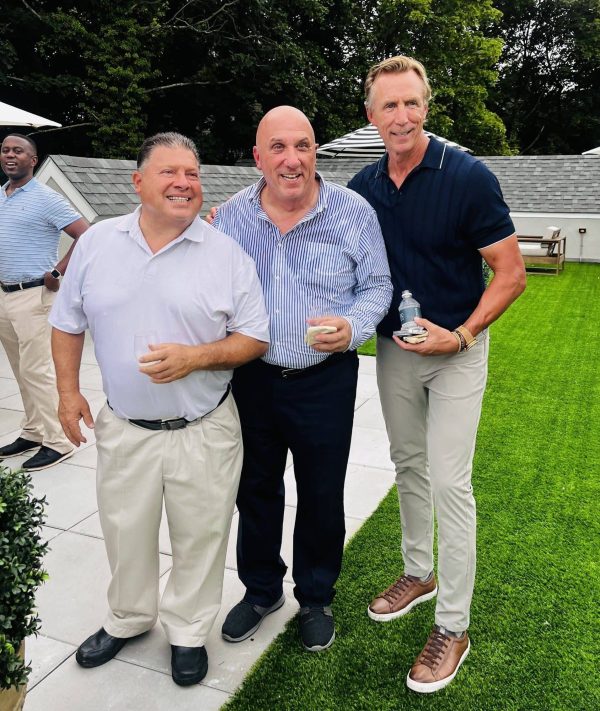 Frank J. Gaudio (center), President and Chief Executive Officer of The First Bank of Greenwich enjoying some time with friends and colleagues. (Photo by Liz Leamy)