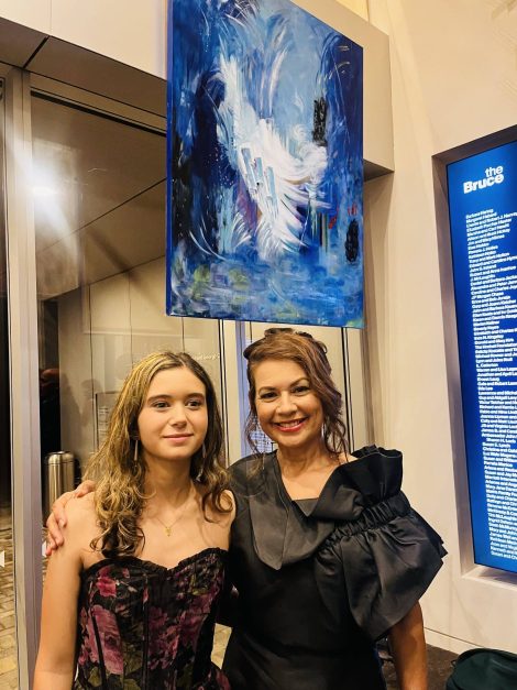 Jodi DeCrenza with her daughter, Gianna Tapia at ‘The First Bank of Greenwich presents Jodi DeCrenza @The Bruce’ last Wednesday night. Decrenza and her daughter are standing under one of her beautiful abstract impressionistic paintings. 