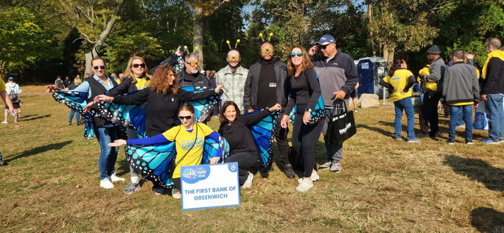 A group of people from the First Bank of Greenwich at the 2024 Abilis Walk/Run. They're wearing butterfly themed costumes.